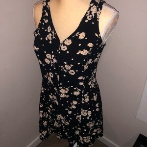 Black romper with light peach rose design